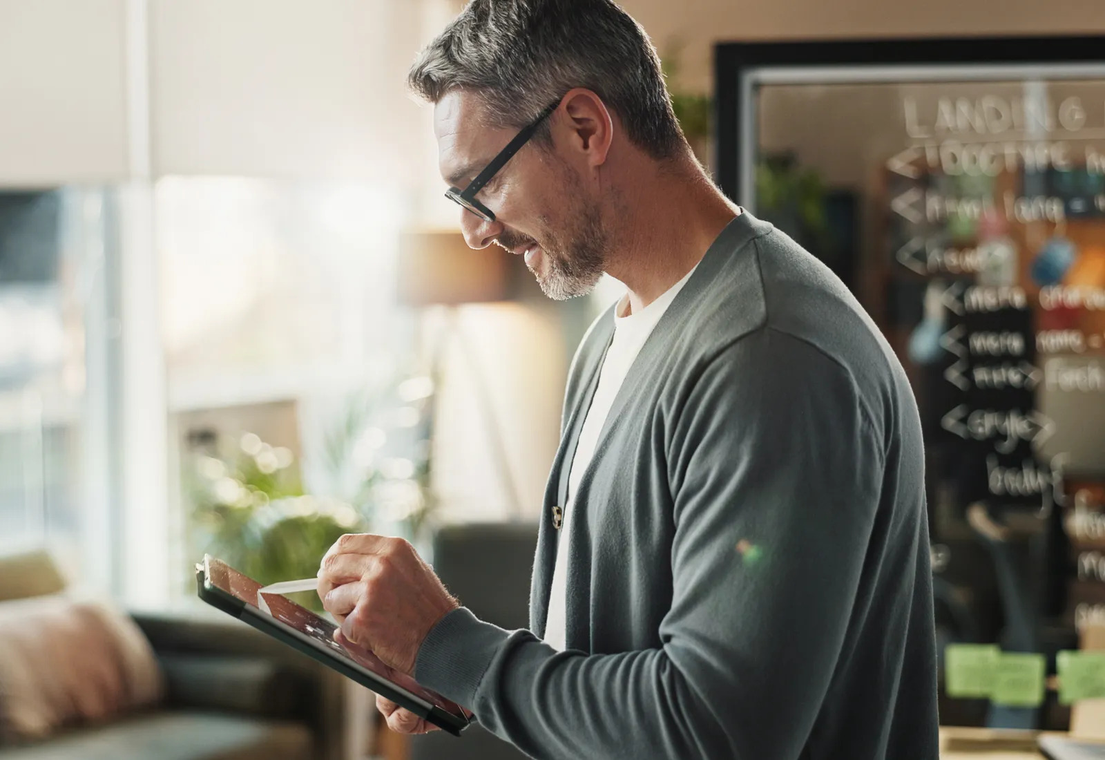 man-reviewing-automatic-exemption-from-penalty-documents-on-tablet